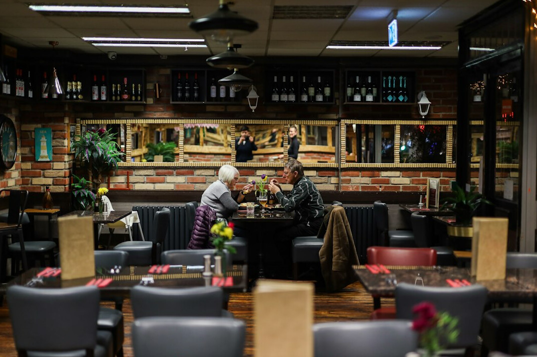 senior citizens chatting at table